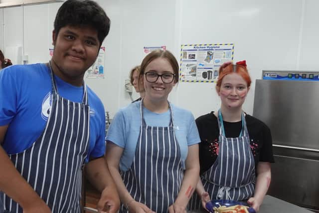 Left to Right - Vhon Prin, Molly Green, Chloe Colton from Communication Specialist College Doncaster taking part in the GUINNESS WORLD RECORDS™ cooking lesson attempt
