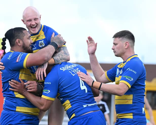 Dons celebrate Pauli Pauli's try at Dewsbury. Picture: Howard Roe/AHPIX.com