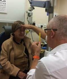 Clients undertaking a one to one eye sight assessment