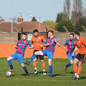 Askern Miners, in red and blue, pictured in action against Harworth Colliery last season. Photo: John Mushet