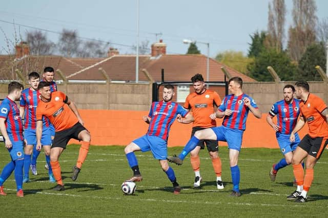 Askern Miners, in red and blue, pictured in action against Harworth Colliery last season. Photo: John Mushet