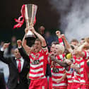Captain Graeme Lee lifts the Trophy as his Doncaster Rovers team-mates celebrate after the Johnstones Paint Trophy Final win over Bristol Rovers at the Millennium Stadium on April 1, 2007 .