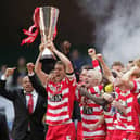 Captain Graeme Lee lifts the Trophy as his Doncaster Rovers team-mates celebrate after the Johnstones Paint Trophy Final win over Bristol Rovers at the Millennium Stadium on April 1, 2007 .