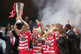 Captain Graeme Lee lifts the Trophy as his Doncaster Rovers team-mates celebrate after the Johnstones Paint Trophy Final win over Bristol Rovers at the Millennium Stadium on April 1, 2007 .