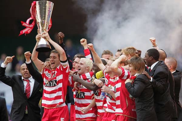 Captain Graeme Lee lifts the Trophy as his Doncaster Rovers team-mates celebrate after the Johnstones Paint Trophy Final win over Bristol Rovers at the Millennium Stadium on April 1, 2007 .