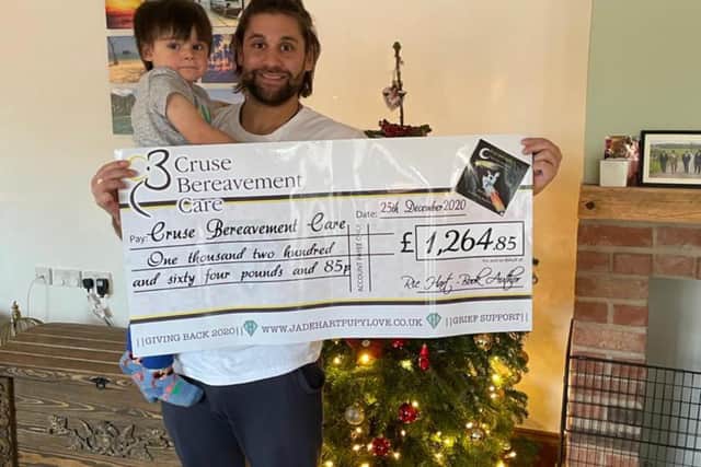 Ric is pictured with Hugo and the first donation of £1,200 for Cruse