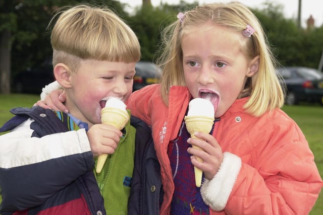 Daniel and Kamara Graham, aged three and six, having fun and an ice-cream at Warmsworth Gala in 2000