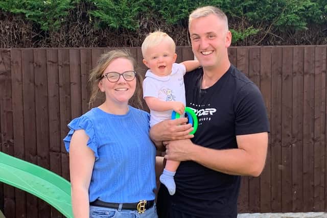 All smiles: George Clarking with his mum Liane and dad Steve.