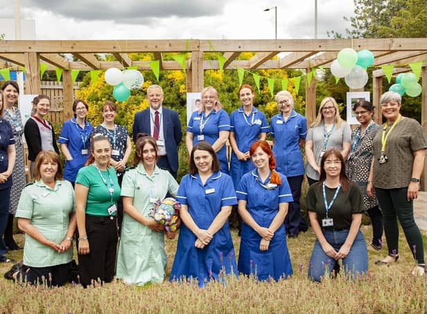 BaBi-D research team celebrate the launch of the study in the Rainbow Gardens at Doncaster Royal Infirmary, alongside are Richard Parker OBE, Chief Executive (centre back), Dr Parveen Ali, Professor of Nursing (stood at the back row, second to last on the right) and Sam Debbage, Deputy Director of Education (stood at the back row, last on the right), at Doncaster and Bassetlaw Teaching Hospitals NHS Foundation Trust.