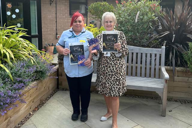 Staff from St John’s Hospice are pictured in the Hospice courtyard garden