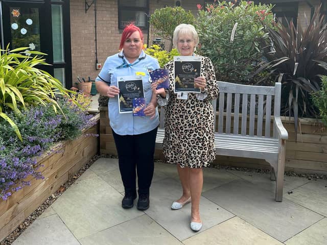 Staff from St John’s Hospice are pictured in the Hospice courtyard garden