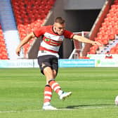 Doncaster Rovers' Owen Bailey demonstrates the attacking side of his game.