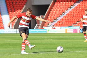 Doncaster Rovers' Owen Bailey demonstrates the attacking side of his game.