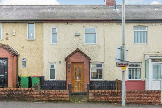 Offers in the region of £100,000 are invited for this three-bedroom, garden-fronted, mid-terrace home, on the market with Reeds Rains.