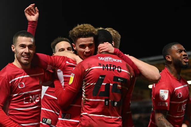 Josh Martin celebrates his goal against Accrington with his teammates. Picture: Howard Roe/AHPIX LTD