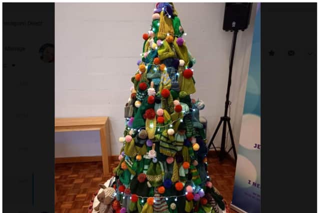 The Christmas tree is crafted from woolly hats.
