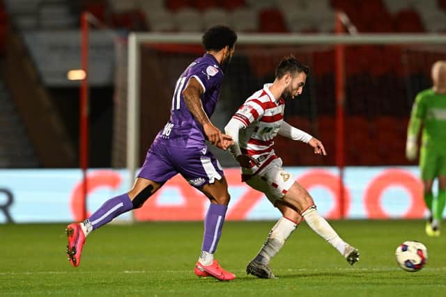 Doncaster Rovers midfielder Ben Close plays a pass against Stevenage.