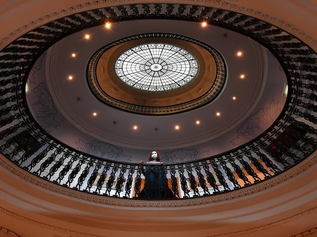 A visitor admires the architecture inside GOMA.