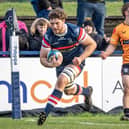 New deal: Thom Smith, scoring a try against Caldy, has signed to remain at Doncaster Knights next season.
