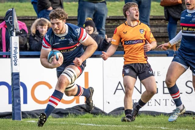 New deal: Thom Smith, scoring a try against Caldy, has signed to remain at Doncaster Knights next season.