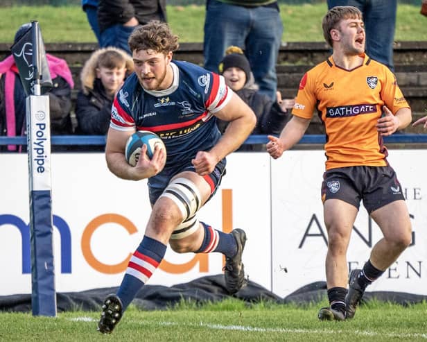New deal: Thom Smith, scoring a try against Caldy, has signed to remain at Doncaster Knights next season.
