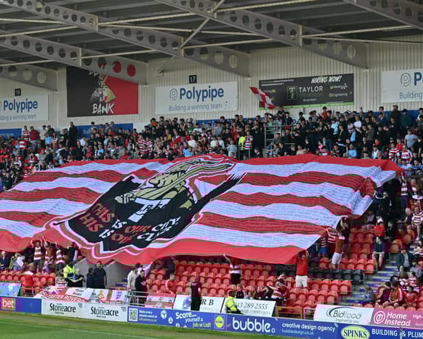 The huge surfer flag, on display against Wimbledon last season, that was crowdfunded by the Black Bank group.