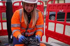 A female trainee engineer working on a fibre joint