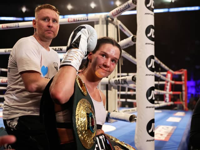 Terri Harper celebrates with the WBA and IBO World super-welterweight belts after defeating Hannah Rankin at the Motorpoint Arena in Nottingham on September 24 (photo by Nathan Stirk/Getty Images).