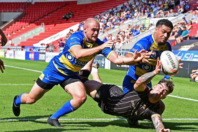 Doncaster’s Brad Hey and Bureta Faraimo in action against Barrow. Picture: Andrew Roe/AHPIX LTD