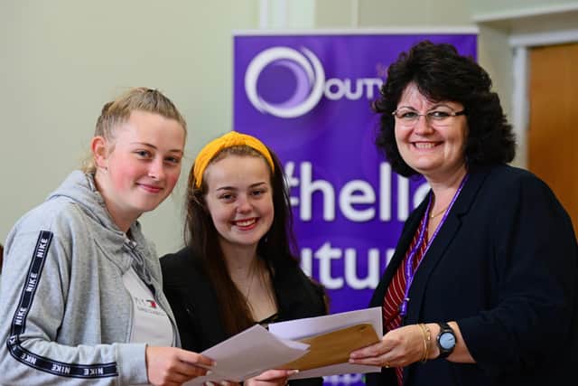 Jayne Gaunt, Principal, pictured with Paige Martin, 18, of Intake, who is heading into Primary school teaching and Riannon Taylor, 18, also of Intake, who is going into Nursing. Picture: Marie Caley NDFP-15-08-19-Alevel-OutwoodAcademyDanum-1