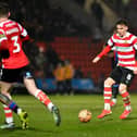 Doncaster Rovers remain in the top three despite defeat at Chesterfield on Friday night.