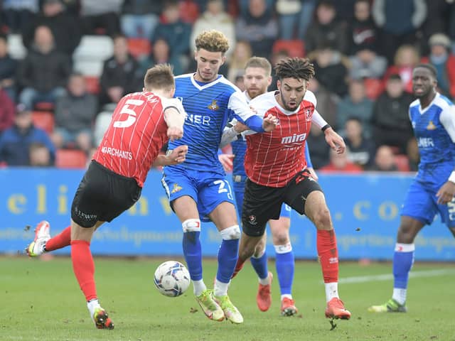 Josh Martin in action against Cheltenham Town. Picture: Howard Roe/AHPIX LTD