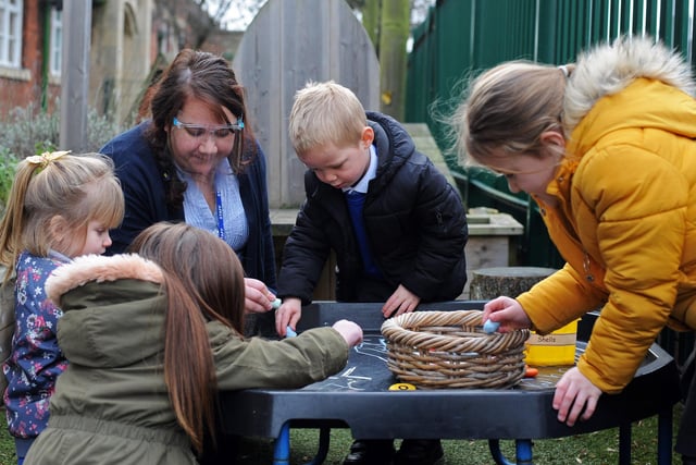 Natalie Poornomansy, Class Teacher, pictured with Foundation Stage Two children in the Outdoor provision.
Picture: NDFP-26-01-21-OutwoodWoodlands 3-NMSY