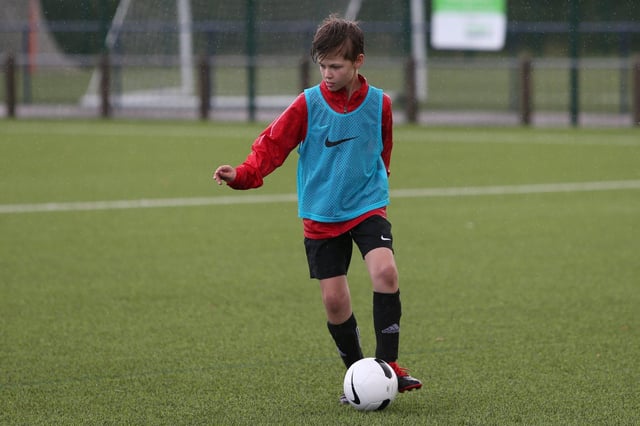 Bryan playing football.