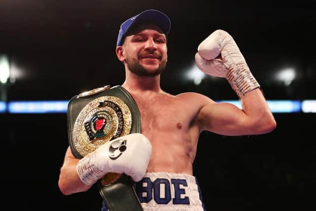 Maxi Hughes celebrates with the IBO world lightweight belt after defeating Kid Galahad. Photo: Nathan Stirk/Getty Images