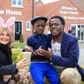 Linden Homes sales executive Kathy with Harper’s Heath residents Joel Memukula and his five-year-old Benjamin
