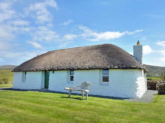 Named Tigh Nighean Bhan, the one bed cottage is a restored thatch blackhouse with incredible views of the Western Isles, located in the breathtaking north end of the Isle of Skye. Although traditional on the outside, the interior is immaculately decorated with luxury furnishings. Currently on sale for 235,000 GBP via R. House