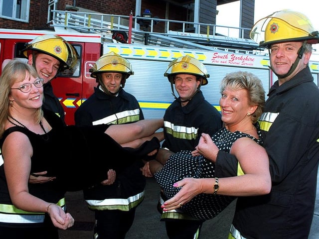 A dream come true for super slimmers Veronica Braithwaite (left) and Lynn Steven as they are 'man handled' by these Doncaster firemen, from the left, Chris Potts, Eddie Nicholson, Paul Wright and Dave Widdop, December 1997