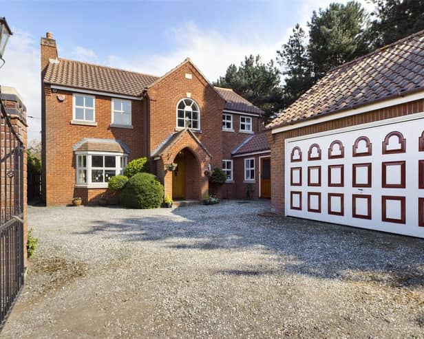 Front view of The Pines,  a driveway providing plenty off road parking and access to the double garage.