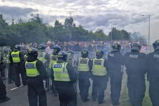 A 19-year-old girl is to appear in court charged over the violent scenes at a hotel housing asylum seekers in Wath last summer.