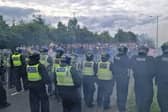 A 19-year-old girl is to appear in court charged over the violent scenes at a hotel housing asylum seekers in Wath last summer.