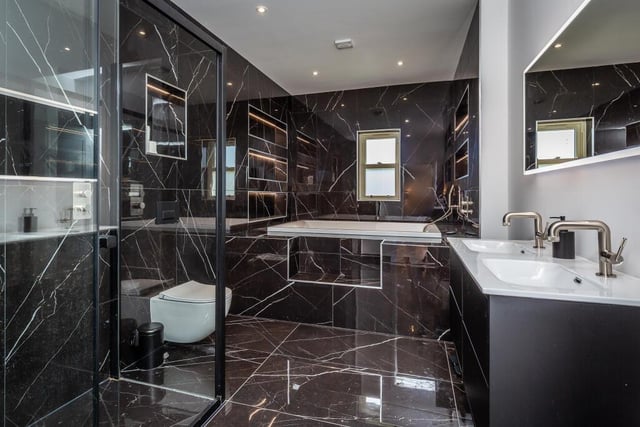 A super stylish bathroom is one of four within the house.