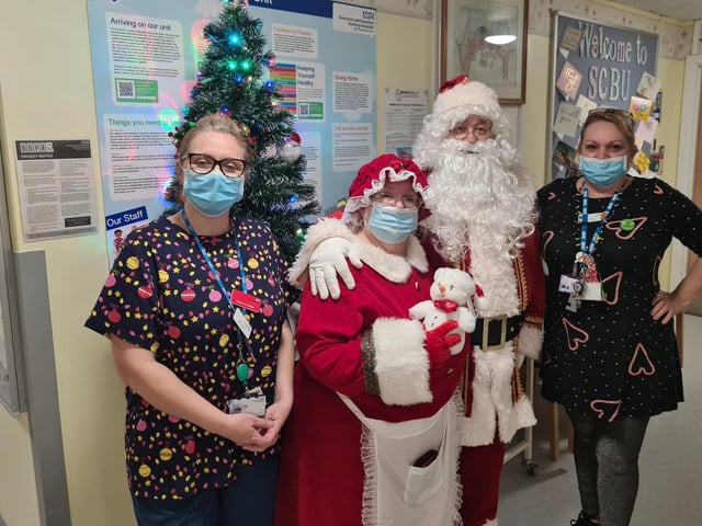 Mr and Mrs Claus and staff