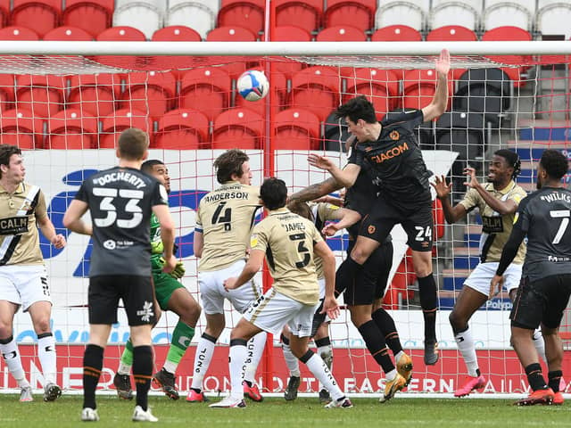 Jacob Greaves heads in Hull's third after more questionable defending from Rovers. Picture: Howard Roe/AHPIX