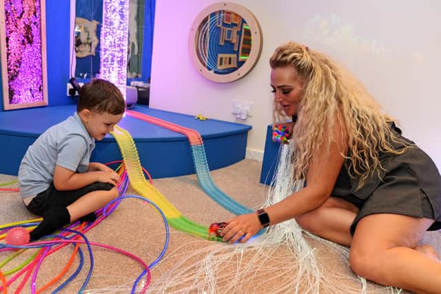 Zoe Godfrey, teaching assistant, pictured with Dexter Woodward, four, in the Academy's new Sensory room. Picture: NDFP-20-07-21-Sensory 1-NMSY
