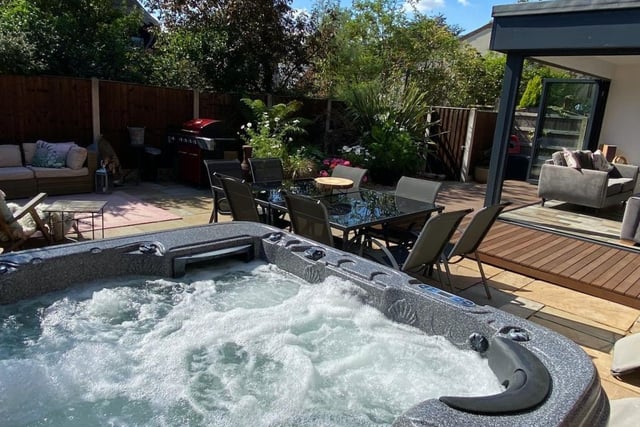 The hot tub is a luxury outdoor feature.