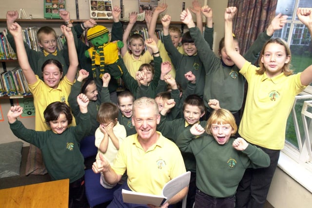Head teacher Joe Dunn of the Southey Green Junior School  with some of the pupils celebrating their OFSTED report.