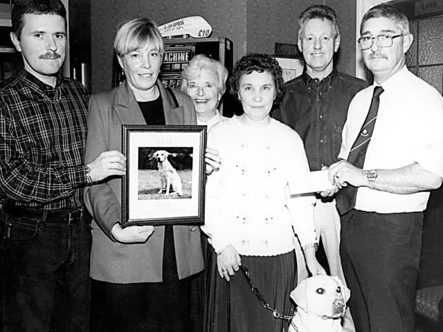 The Ivanhoe Hotel, Sprotbrough, raised £2,500 for the Guide Dogs for the Blind - pictured at the presentation are, left to right: Graham Canning fund raising regular, Val Woolrich RNIB centre manager, Pat Grainger chairman Doncaster RNIB, Pauline Aird and her Guide dog Beauty, Peter Huddart fund raising regular and Trevor Wiliams, landlord, October, 1996