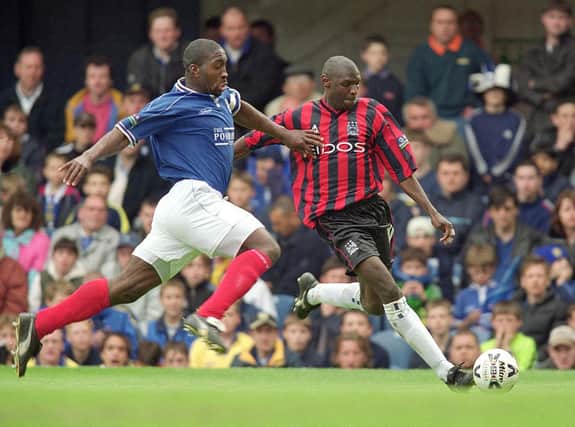 Darren Moore, in his playing days for Portsmouth, up against Manchester City's Shaun Goater