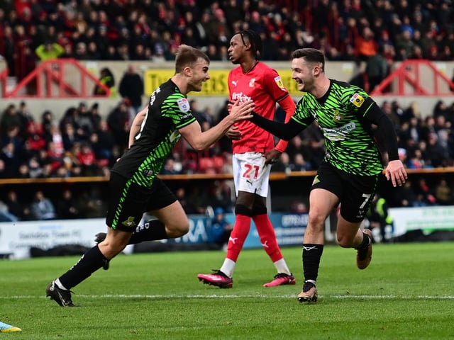Luke Molyneux celebrates his second goal with George Miller.